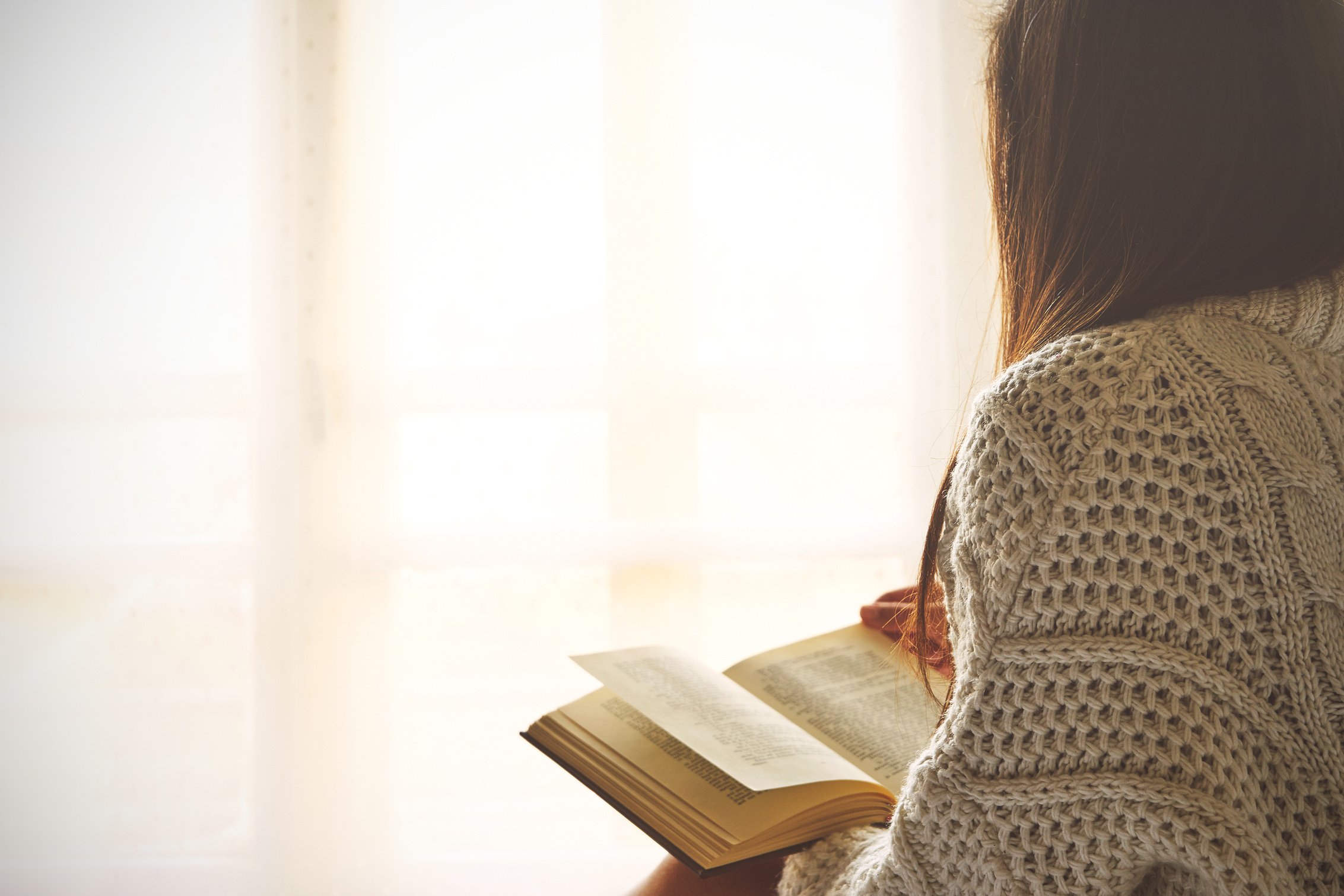 Young Woman Reading a Book